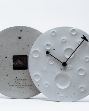 Wall clock made of concrete in the form of the moon ?Around the Moon in 60 Minutes?